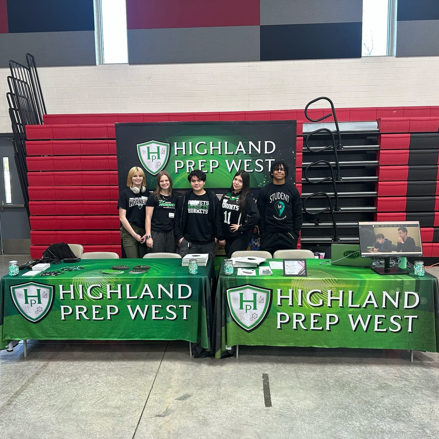 Highland Prep West students staffing an information table at a school event