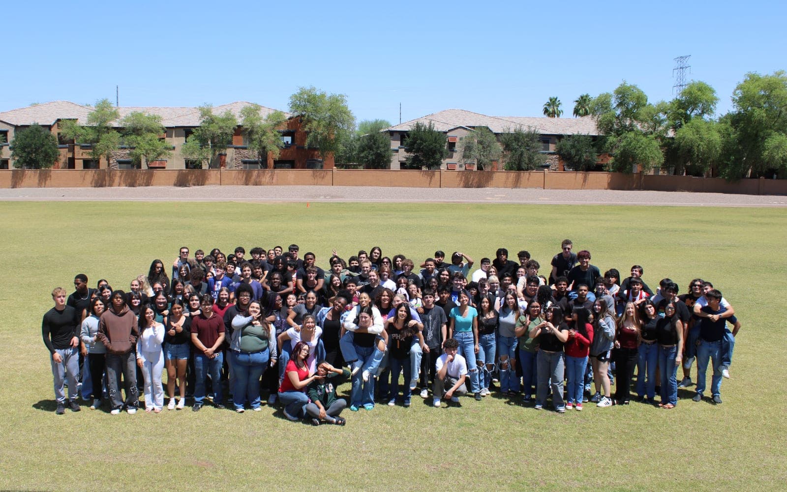 The Highland Prep West senior class gathered on the field for a group photo