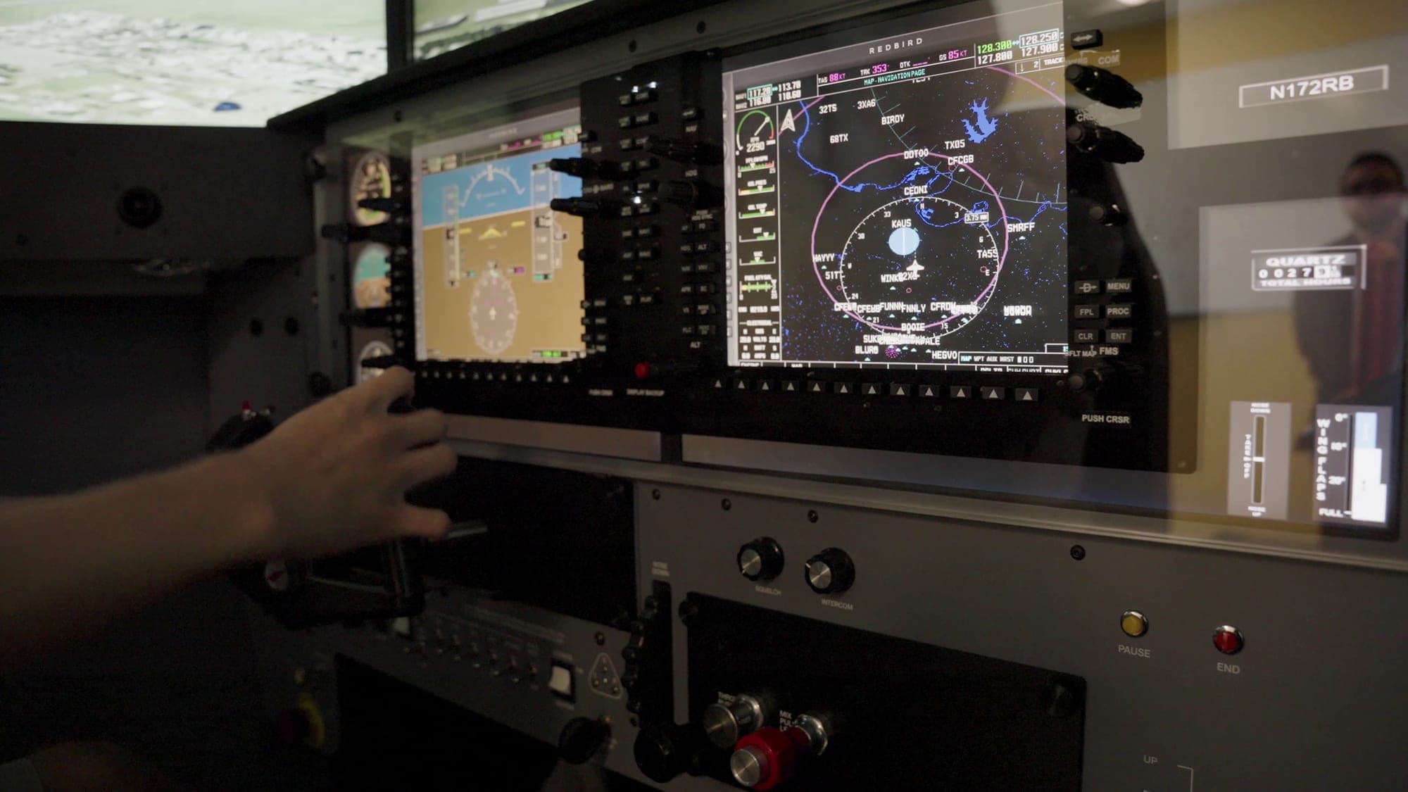 The glass cockpit and navigation display of the RedBird FMX flight simulator